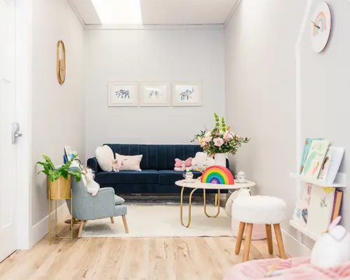 A child psychology clinic waiting room with toys, flowers, and child-friendly decor.